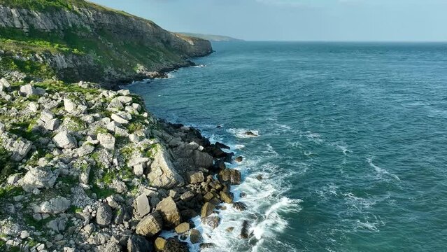 Valley of stones. Atlantic Ocean beach. England, Dorset. Cinematic drone flight