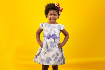 Brazilian black child with curly hair, in studio shot with various facial expressions