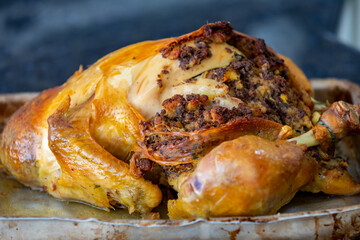 Traditional homemade mayonnaise salad with roasted chicken stuffed with Brazil-style farofa