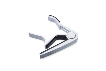 Guitar capodaster on a white isolated background