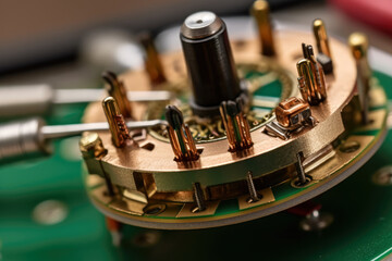 Close-up of a small yet robust motor inside a miniature electronic device with circuit boards and connectors