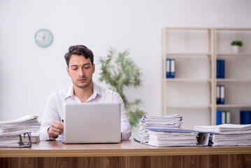 Young male employee working in the office