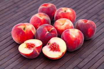 Fototapeta na wymiar Image of sweet juicy peaches fruit on wooden surface close up