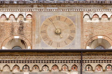 Clock on the facade of the medieval building in Padua