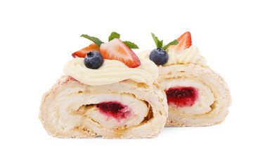 Slices of tasty meringue roll with jam, berries and mint leaves isolated on white