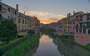 Fototapeta na wymiar Charming Medieval Canal Scene in Padua Italy