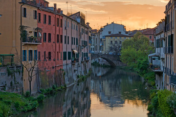 Fototapeta na wymiar Twilight Romance in Padua Canal at Sunset