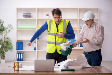 Fototapeta premium Two male architects working on the project