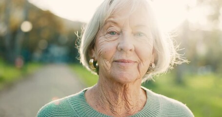 Smile, senior and face of a woman in nature for a walk, break or relax in retirement. Summer, park and portrait of an elderly person in a nursing home garden or park for fresh air or outdoor peace - Powered by Adobe