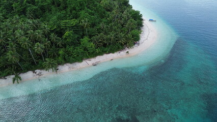 Summer seascape beautiful waves, blue sea water in sunny day. Top view from drone. Sea aerial view, amazing tropical nature background. Beautiful bright sea with waves splashing and beach sand concept