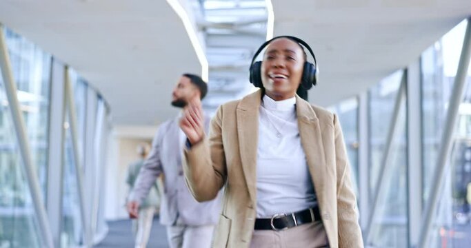 Headphones, music and business woman dance with high five in office walking with motivation. Company, African female worker and web radio listening to audio feeling happy with freedom and excited