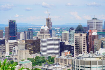 Fototapeta premium Montreal, Quebec Canada -07 12 2023: Aerial view of Montreal downtown from Royal Mount 