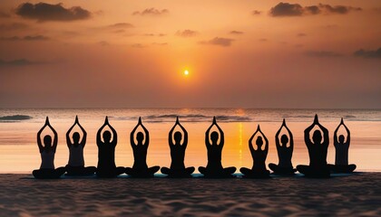 Silhouettes of group meditating at beach yoga retreat during sunset