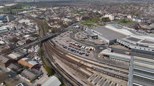 Daytime birds eye fly over Hull Paragon Station as a train leaves.