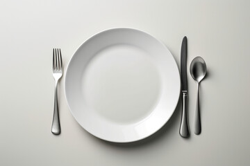 plate with fork and knife on white background