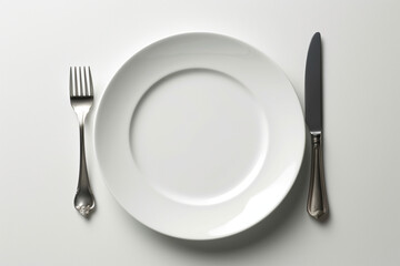 plate with fork and knife on white background