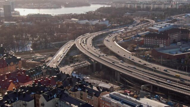 Busy traffic on the bridges connecting Vasastan district and Kungsholmen island. Aerial dynamic video. 