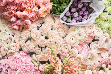 Many different colors. Showcase. Background of mix of flowers. Beautiful flowers for catalog or online store. Floral shop and delivery concept. Top view