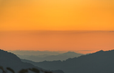 Scenic view dramatic beautiful sunset sky. Natural Sunset Sunrise on meadow silhouette shadow dark land. Vibrant dramatic sky on sunset, dawn, sunrise in Countryside. Landscape Colorful Sky At Sunset