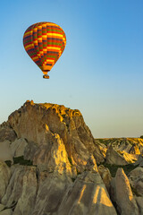 Hot air balloons flying over the valley at Cappadocia, Turkey.