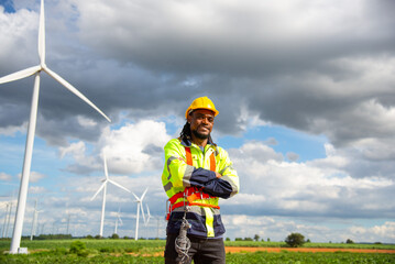 Fototapeta na wymiar Wind turbine Engineer working in wind turbine farm , Generator station, renewable energy , Sustainable energy industry concept
