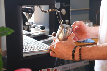 coffee machine and barista hand close up 