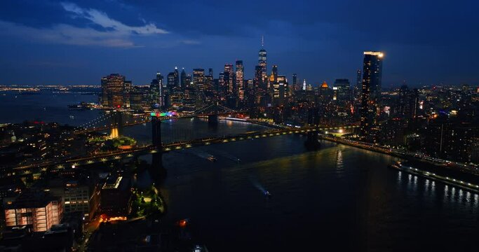 Night cityscape of stunning New York, USA. City of lights. Metropolis panorama from drone.