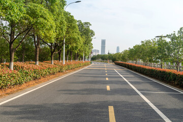 Empty urban road and buildings in the city - 630180943