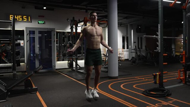 Sport and exercising people. Active sport workout. Workout of man in gym. fit and active sportsman skipping rope. Best cardio workout. athlete skipping with jump rope. determination