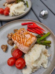 Salmon steak dish is being prepared as a family dinner dish.