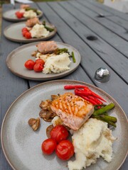 Salmon steak dish is being prepared as a family dinner dish.