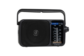 Radio receiver on a white background. Black portable wireless radio close-up isolated on a white background.