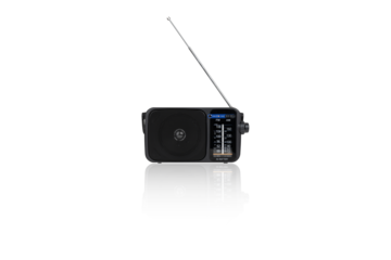 Radio receiver on a white background. Black portable wireless radio close-up isolated on a white background.