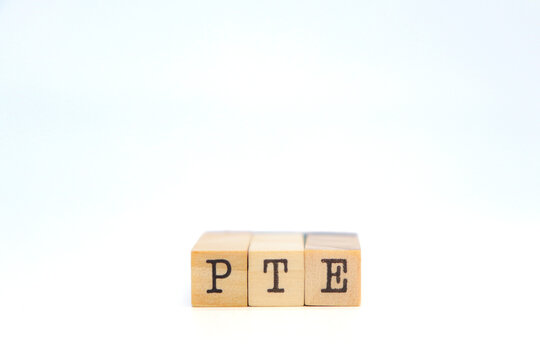 pte word on wooden cubes. Pearson Tests of English concept