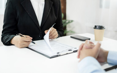 HR Managers hold a resume and talk to job applicants for job interviews about careers and Their personal history in the company. Employment and Recruitment concept