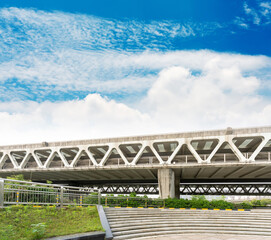 Pedestrian bridge against blue sky