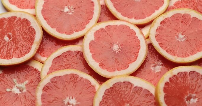 top down background view made of Fresh Sliced organic grapefruit close-up