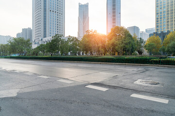 Empty urban road and buildings in the city - 630195321