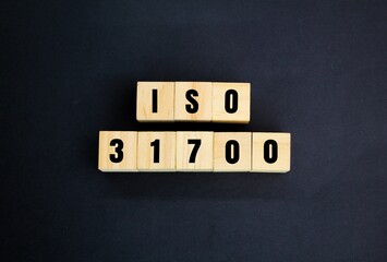 wooden cube with words and numbers iso 31700. Privacy by Design for consumer goods and services