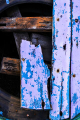 top view of weathered wood with faded white paint, not neatly arranged