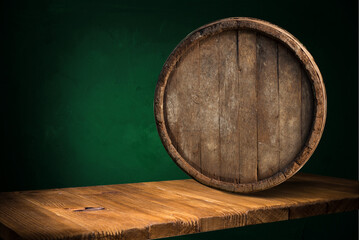 Beer barrel with beer glasses on table on wooden background