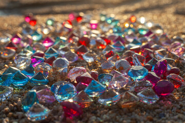 Colorful diamonds scattered on the beach The sun glistened off the facets of the precious stones,...