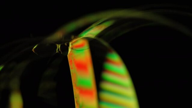 Colorful bubbles spinning on black background. Abstract, overlay