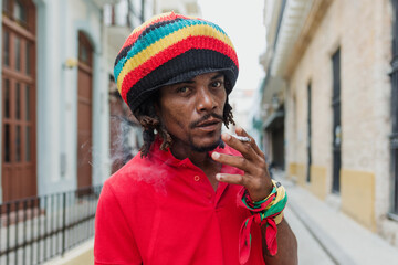 African American man with dreadlocks in Latin America, rastafarian or rastaman caribbean people in...