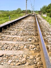 Fototapeta na wymiar Steel rails on a single track railway