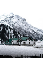 Beautiful winter landscape with snow covered trees and mountains in Kashmir.