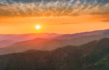 Obraz premium summer scenery mountain view from a highland hill to a beautiful sunset.