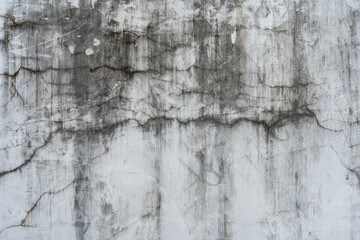 Cracked concrete wall surface, vintage horror background, dirty damaged cement wall texture.