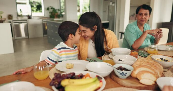 Family, food and a mother and child at home for breakfast, quality time and love at a table. Grandmother, woman and child rub noses in a dinning room eating a healthy meal with happiness and care
