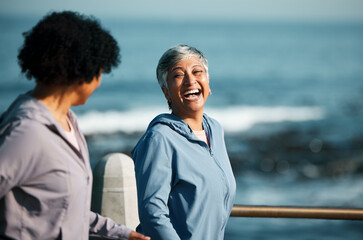 Fitness, happy and senior women by ocean for healthy body, wellness and cardio wellbeing on promenade. Sports, friends and female people walking on boardwalk for exercise, training and workout